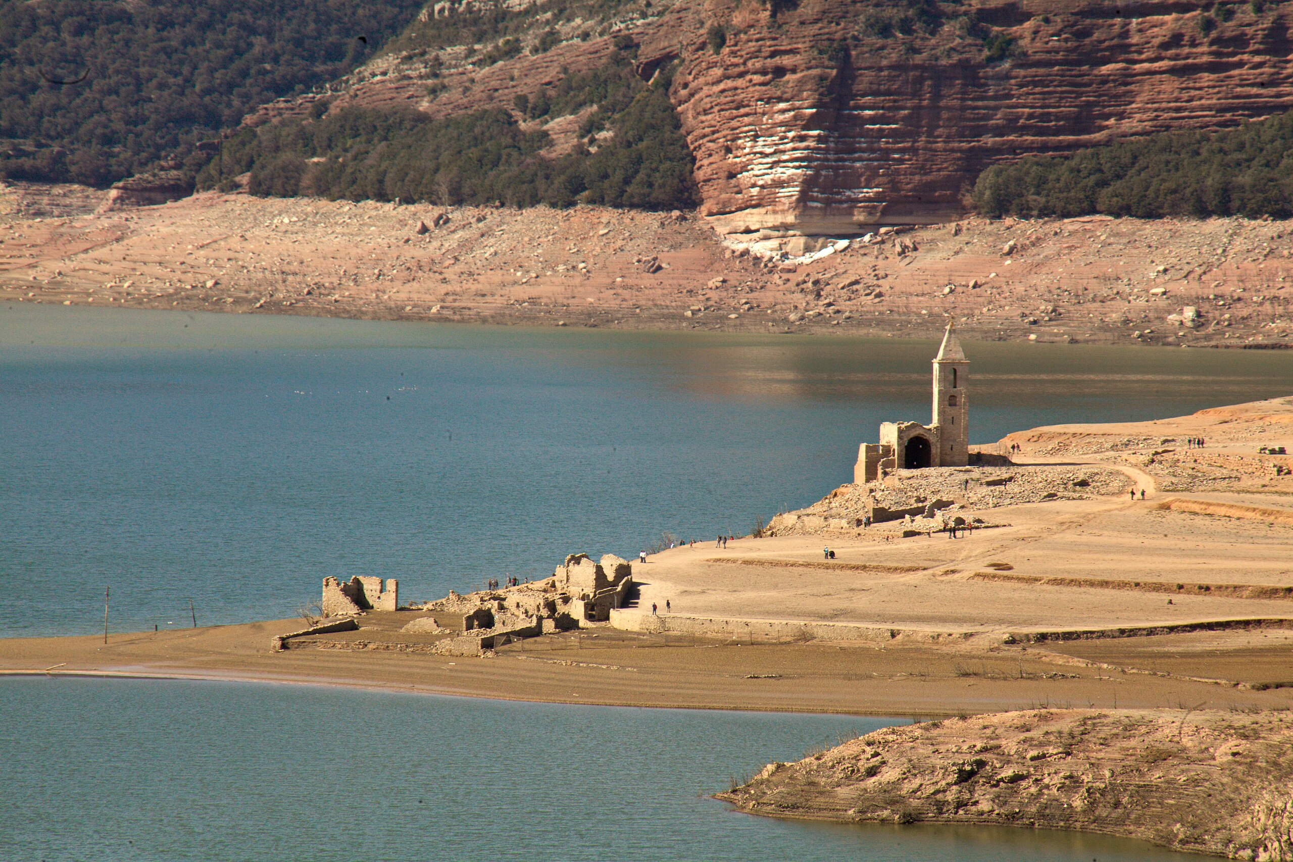 The old church of Sant Romà by the receding waters of the Sau Reservoir.