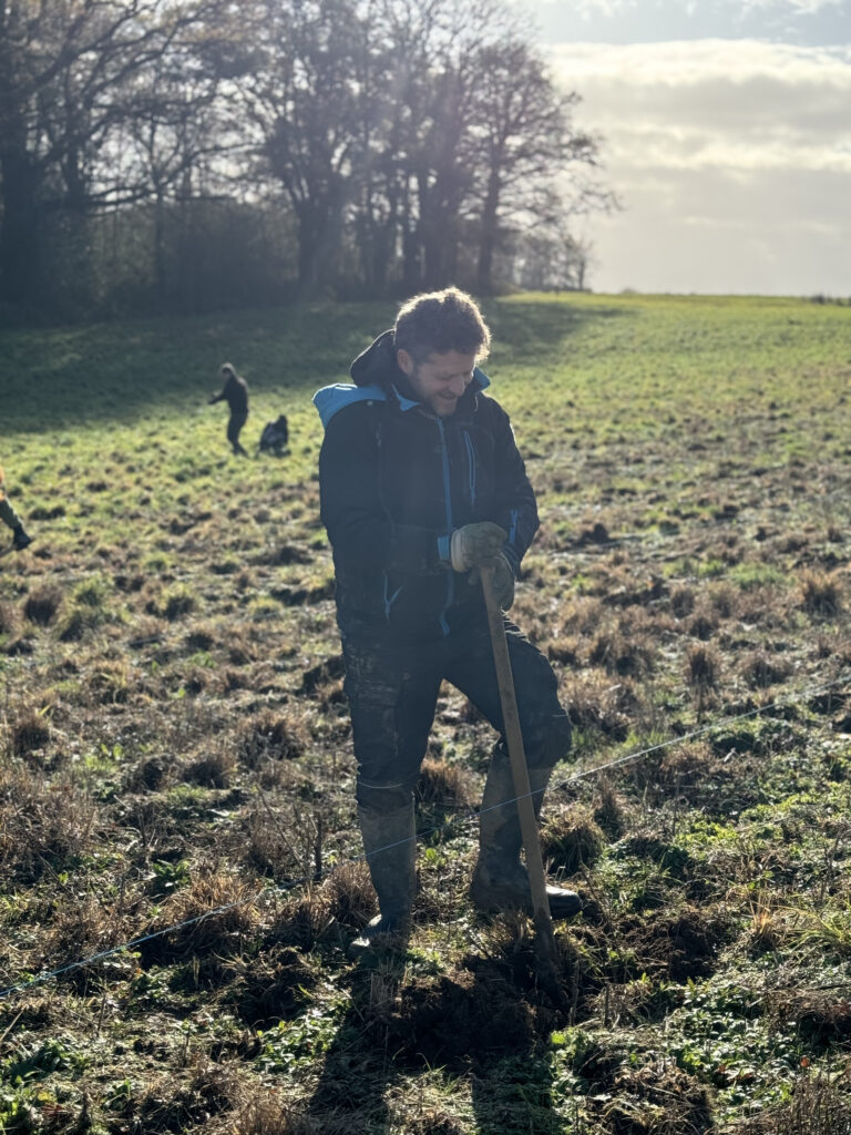 Olivier Stulmacher planting trees at the Vernessac farm.